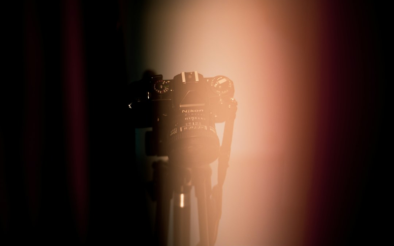 Microphone on the small stage at PowerupDash under a single warm spotlight
