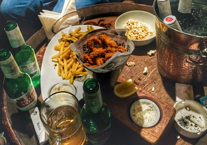 Loaded fries, chicken bites and dips on a share platter at the bar
